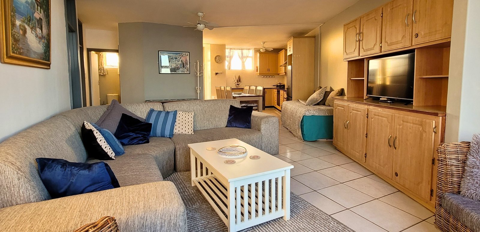 Top Deck Haven — spacious lounge with twin ocean-view windows